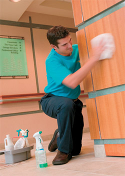 man wiping wall