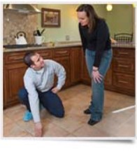 tech explaining tile work to customer